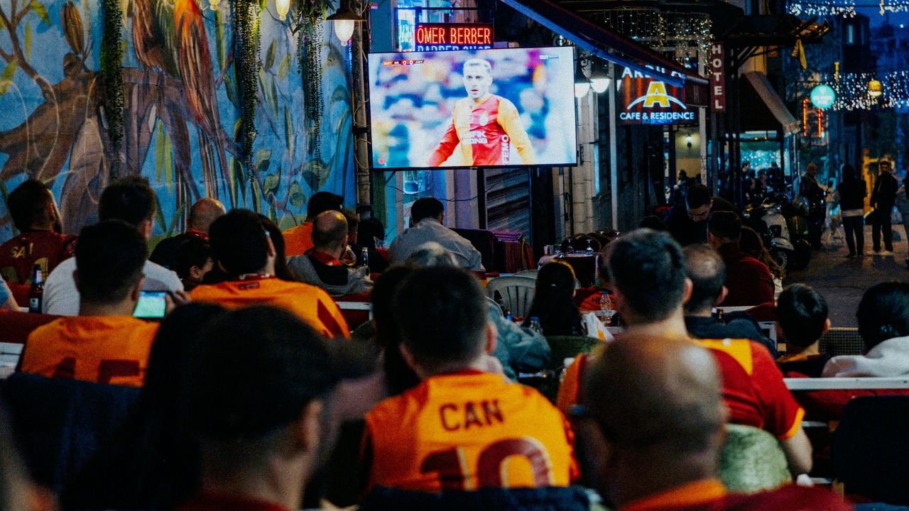 Fans celebrating together during a live match